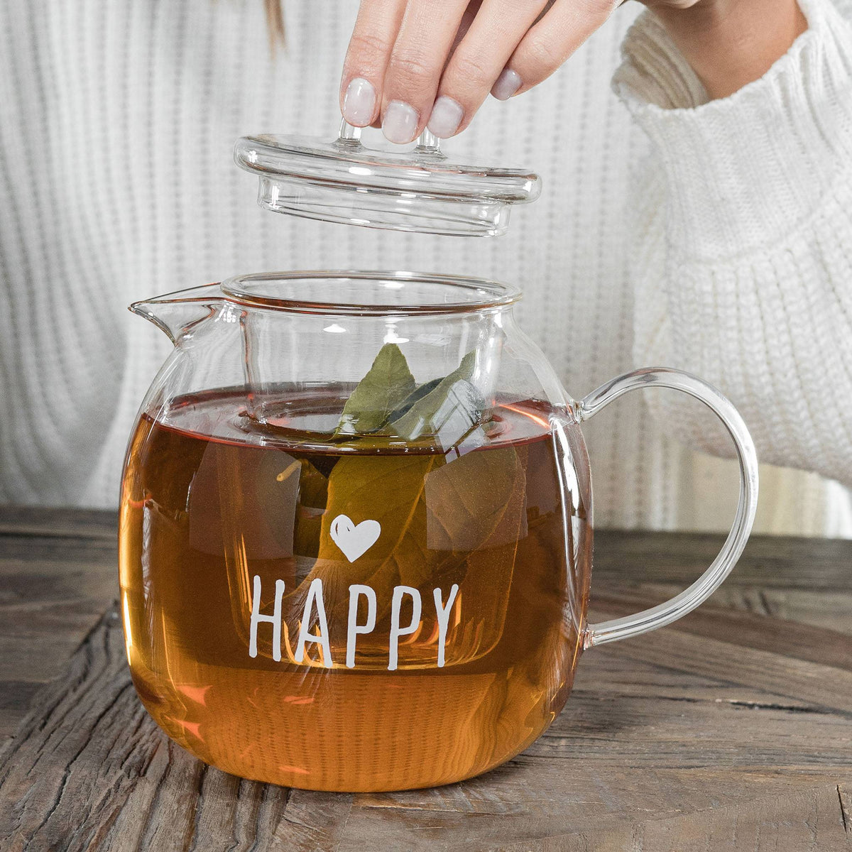 Teiera piccola con infusore Una tazza di tè, trasparente. Simple day